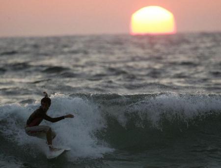 surfing in the sunset